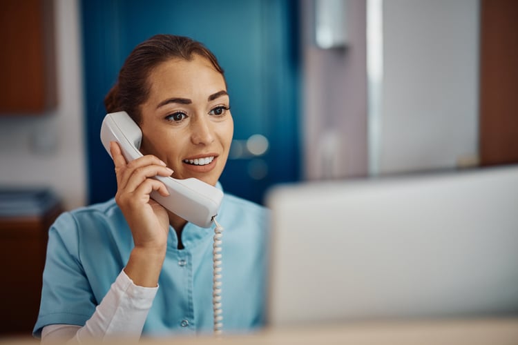 Billing nurse on phone reducing claim denials