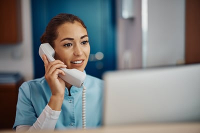 Billing nurse on phone reducing claim denials
